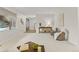 Open-concept living area with contemporary furniture and natural light, ideal for entertaining at 6602 S Vance St, Littleton, CO 80123