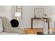 Cozy living room showcasing hardwood floors, stylish decor, and minimalist furnishings at 6602 S Vance St, Littleton, CO 80123