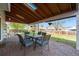 Charming covered back patio with brick pavers, perfect for outdoor dining and entertaining at 6323 W 85Th Ave, Arvada, CO 80003
