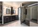 Primary bathroom featuring a double sink vanity, a walk-in shower, and ceramic tile flooring at 6323 W 85Th Ave, Arvada, CO 80003