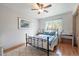 Cozy bedroom featuring natural light from a large window and hardwood floors at 6323 W 85Th Ave, Arvada, CO 80003