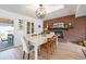Dining area with hardwood floors, fireplace, skylight, and access to the backyard at 6323 W 85Th Ave, Arvada, CO 80003