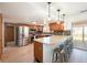 Spacious kitchen with a breakfast bar, stainless steel appliances, and a view to the backyard at 6323 W 85Th Ave, Arvada, CO 80003
