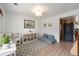 Bright living room featuring a play area with a toy kitchen, a cozy sofa, and natural light at 6323 W 85Th Ave, Arvada, CO 80003