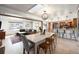 Bright and open floorplan connecting the dining area, living room, and kitchen, creating a seamless flow at 6323 W 85Th Ave, Arvada, CO 80003