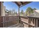 Cozy balcony with wooden railing offers neighborhood views and blue skies at 9995 E Harvard Ave # 246, Denver, CO 80231