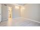 Bedroom featuring an ensuite bathroom, modern flooring and neutral paint at 9995 E Harvard Ave # 246, Denver, CO 80231