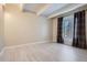 Spacious bedroom with large window with modern flooring and neutral paint at 9995 E Harvard Ave # 246, Denver, CO 80231