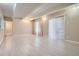 Spacious living room featuring a sliding glass door, light wood floors, and neutral paint at 9995 E Harvard Ave # 246, Denver, CO 80231
