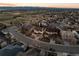 Neighborhood aerial shot showcasing well-maintained homes, green spaces, and a scenic view of the mountains at 2577 Shadecrest Pl, Highlands Ranch, CO 80126