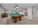 Finished basement boasts a pool table, recessed lighting, and comfortable carpeting at 2577 Shadecrest Pl, Highlands Ranch, CO 80126