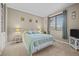 Comfortable bedroom with a queen bed, a bright window, and carpet flooring at 2577 Shadecrest Pl, Highlands Ranch, CO 80126