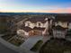 A captivating two-story home with a beautiful stone and siding exterior, plus a well-kept lawn at 2577 Shadecrest Pl, Highlands Ranch, CO 80126