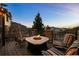 Outdoor fire pit surrounded by comfortable seating, ideal for relaxing evenings outside at 2577 Shadecrest Pl, Highlands Ranch, CO 80126