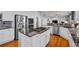 Spacious kitchen with stainless steel appliances, granite counters, and gas cooktop island at 2577 Shadecrest Pl, Highlands Ranch, CO 80126