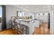 Bright, spacious kitchen featuring granite counters, stainless appliances, and a breakfast bar at 2577 Shadecrest Pl, Highlands Ranch, CO 80126