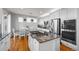 Bright, spacious kitchen featuring granite counters, stainless appliances, and a breakfast bar at 2577 Shadecrest Pl, Highlands Ranch, CO 80126