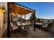 Comfortable outdoor dining area with a stylish table, chairs, and a cozy fire pit for gatherings at 2577 Shadecrest Pl, Highlands Ranch, CO 80126