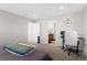Bright bedroom with an ensuite bathroom and a dedicated workspace at 21650 E Tufts Cir, Aurora, CO 80015