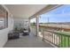 Relax on this covered patio with comfortable seating and scenic views of the fenced yard at 21650 E Tufts Cir, Aurora, CO 80015