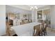 Bright dining room offering plentiful natural light and sliding glass doors to the outdoor patio at 21650 E Tufts Cir, Aurora, CO 80015