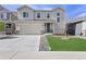 Charming two-story home features a well-manicured lawn, a two-car garage, and stone accents at 21650 E Tufts Cir, Aurora, CO 80015
