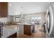 Bright, open kitchen seamlessly flows into the living and dining areas, perfect for entertaining at 21650 E Tufts Cir, Aurora, CO 80015