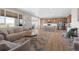 Expansive open-concept living room connects to the kitchen, creating a comfortable and inviting space at 21650 E Tufts Cir, Aurora, CO 80015