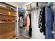 Organized walk-in closet with shelving and hanging space, maximizing storage and convenience at 21650 E Tufts Cir, Aurora, CO 80015