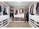 Spacious walk-in closet with custom shelving and ample storage space at 21650 E Tufts Cir, Aurora, CO 80015
