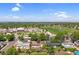 Aerial view of a residential area with green trees and grassy sports fields at 1982 S Truckee St, Aurora, CO 80013