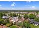 Neighborhood aerial view with tree-lined streets and well-maintained homes on a sunny day with blue sky at 1982 S Truckee St, Aurora, CO 80013