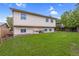 Wide shot of a home's backyard featuring a grassy area and privacy fence at 1982 S Truckee St, Aurora, CO 80013