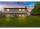 Exterior of the home's backyard with green grass and a serene outdoor living space at 1982 S Truckee St, Aurora, CO 80013