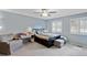 Bedroom featuring blue walls, a ceiling fan, and a large window with white shutters at 1982 S Truckee St, Aurora, CO 80013