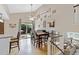 Bright dining area features modern decor, high ceilings, and sliding glass doors to the patio at 1982 S Truckee St, Aurora, CO 80013