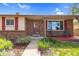 Charming home with a brick facade and covered porch, perfect for relaxing outdoors at 1982 S Truckee St, Aurora, CO 80013