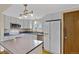 Traditional kitchen with light gray cabinets, stainless steel appliances and an island at 1982 S Truckee St, Aurora, CO 80013