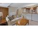 Finished basement Gathering room with comfortable couch and stairway to upper level at 1982 S Truckee St, Aurora, CO 80013