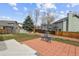 Large backyard featuring a patio, green grass, and a wooden fence, perfect for outdoor entertaining at 9392 Crestmore Way, Highlands Ranch, CO 80126