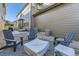 Backyard patio area with gravel, modern Adirondack chairs and a covered fire pit, perfect for relaxing outdoors at 21851 E Tallkid Ave, Parker, CO 80138