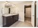 Bathroom featuring a double vanity and a walk-in closet at 21851 E Tallkid Ave, Parker, CO 80138