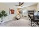 Comfortable bedroom showcasing a ceiling fan, framed jersey, and a cozy reading nook at 21851 E Tallkid Ave, Parker, CO 80138