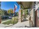Inviting porch with stone columns and ample seating to enjoy the neighborhood at 21851 E Tallkid Ave, Parker, CO 80138