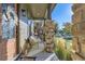 Inviting porch with stone columns and ample seating to enjoy the neighborhood at 21851 E Tallkid Ave, Parker, CO 80138