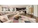 Open-concept living area with hardwood floors that flows into the kitchen and dining areas at 21851 E Tallkid Ave, Parker, CO 80138