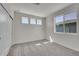 Well-lit bedroom featuring three windows for ample natural light and a spacious closet at 11902 Octave Ave, Parker, CO 80134