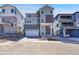 Modern two-story home featuring mixed siding, a two-car garage, and a covered front porch at 11902 Octave Ave, Parker, CO 80134