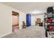Open basement with carpet and a utility room; perfect for storage or customization to suit various needs at 4828 S Nucla Way, Aurora, CO 80015