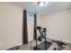 Basement room featuring exercise equipment, neutral carpeting, and a window for natural light at 4828 S Nucla Way, Aurora, CO 80015